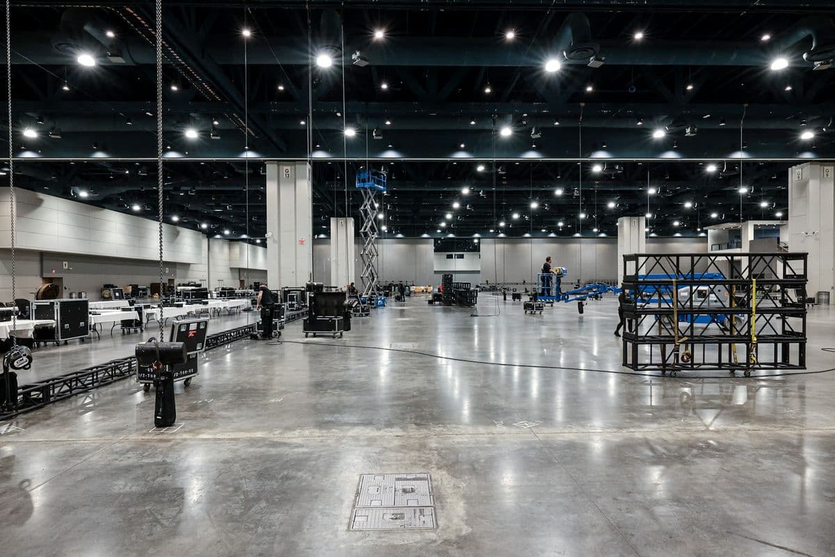 Convention hall load in with truss, road cases and a scissor lift